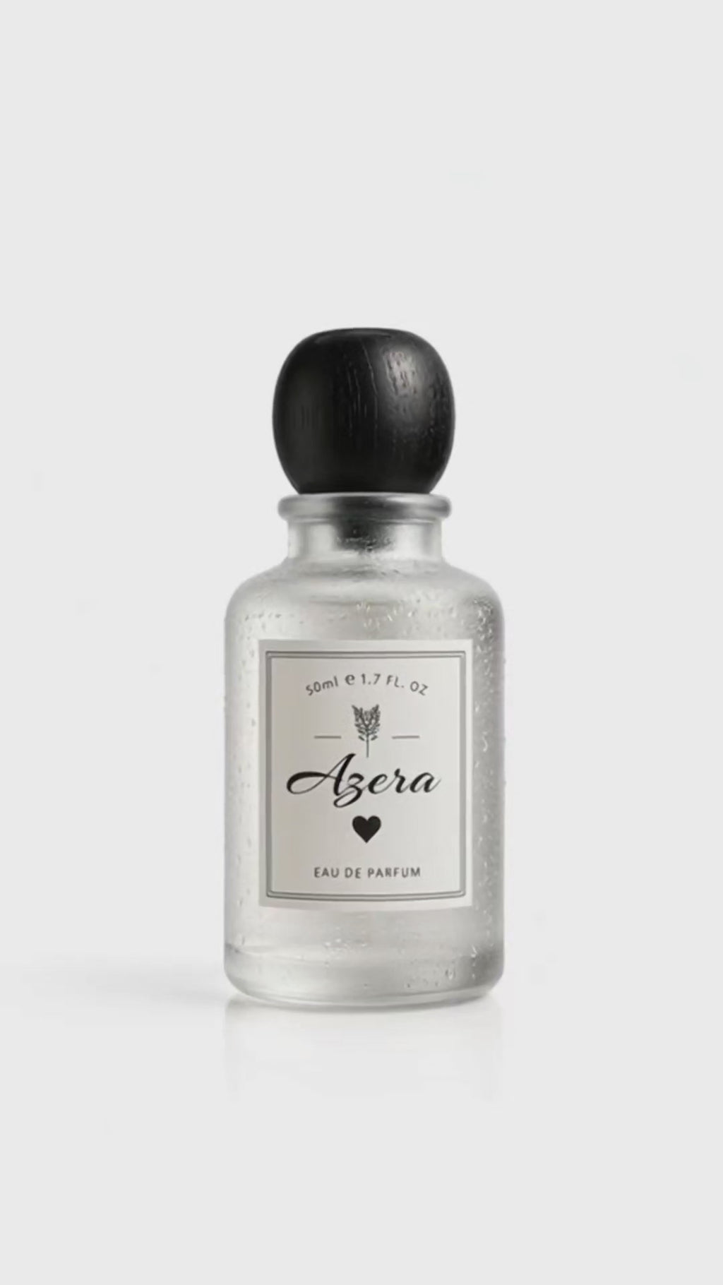 Bloograna Perfumes Azera perfume bottle with elegant design and floral accents, showcasing luxurious fragrance packaging.