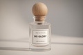 Bottle of BG GLORY perfume by Bloograna Perfumes, elegant glass container with a sleek design and floral accents.